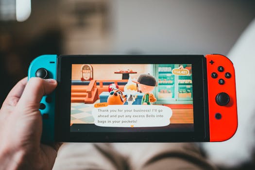 Close-up of a person enjoying a colorful video game on a handheld console indoors.